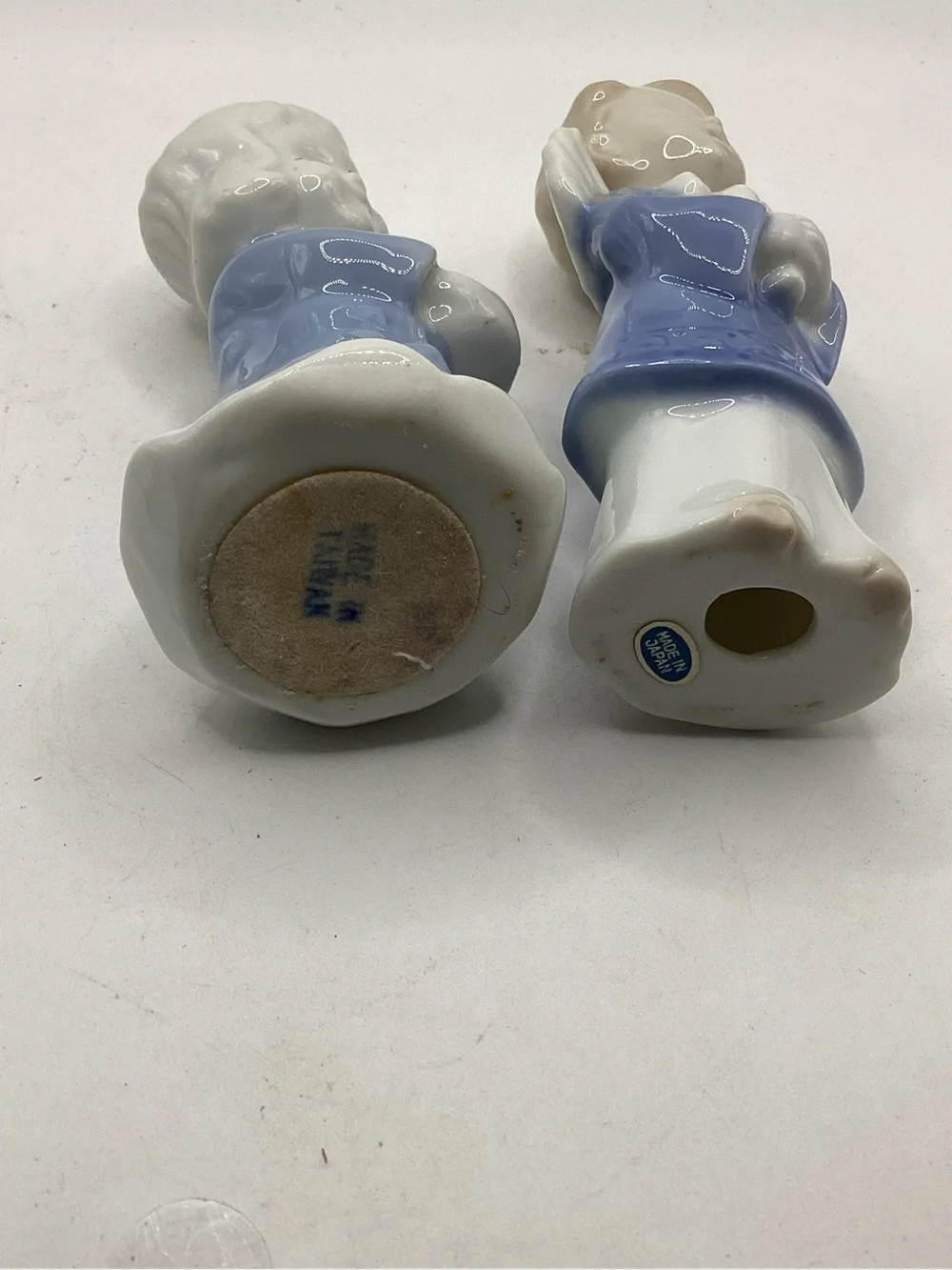 Porcelain Angel Figurine Pair in Blue and White. One holds candle.